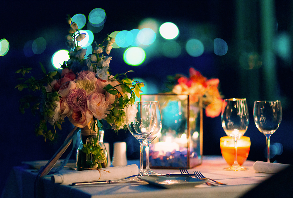 flowers and candles on table