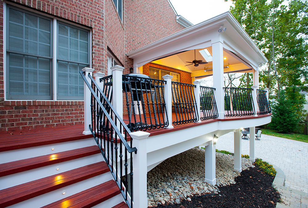 red stained porch metal railing