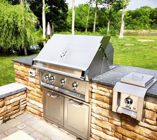 stone and stainless outdoor grill