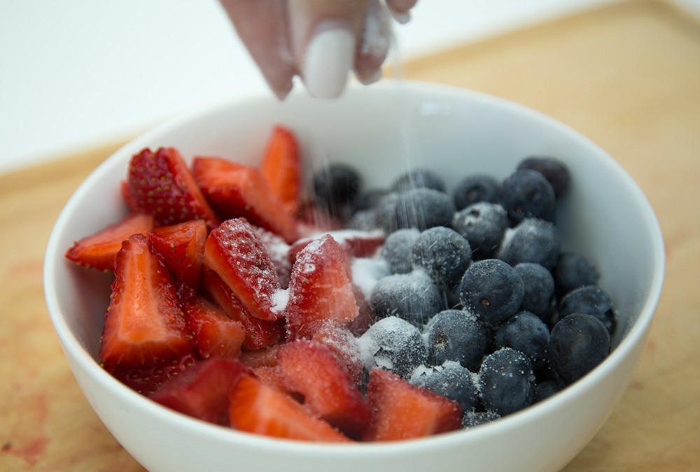 strawberries and blueberries and sugar