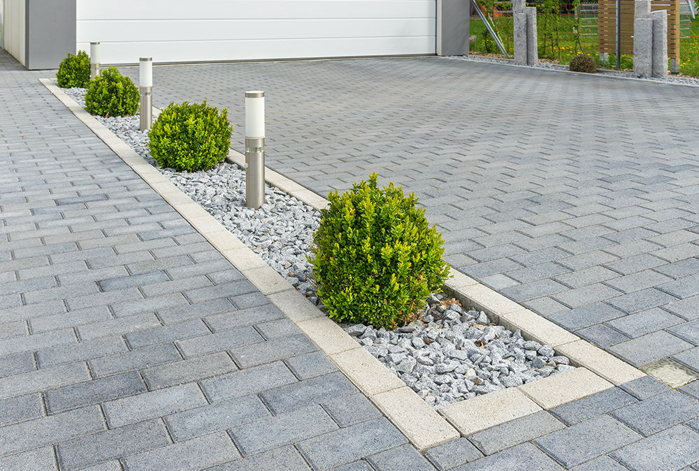 stone driveway with bushes