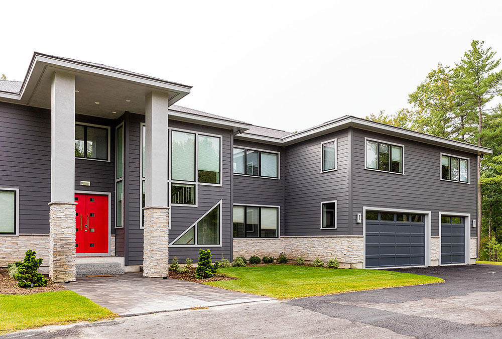 grey modern house with red door