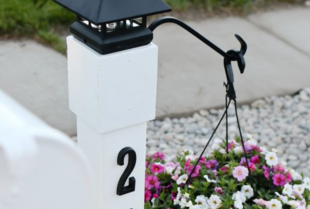 address post with hanging flower basket