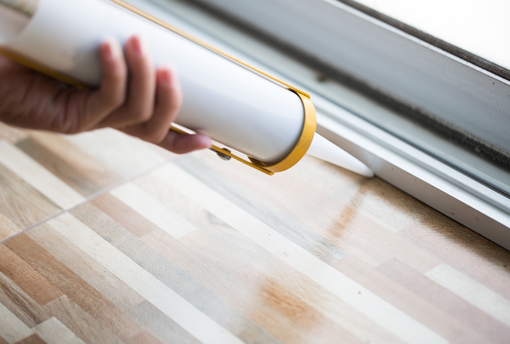 caulking under door