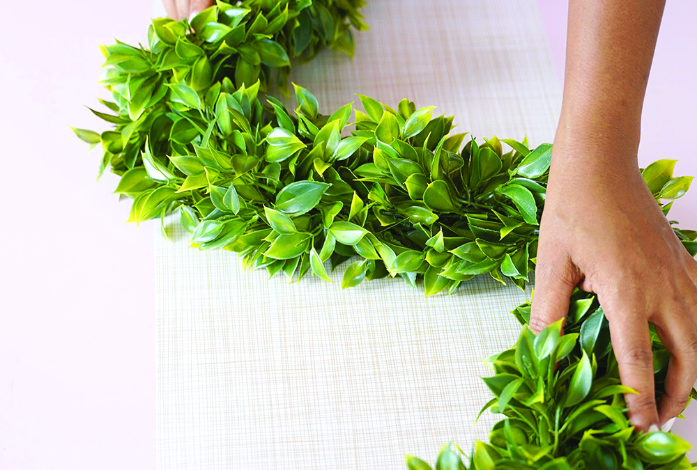 green garland with hand