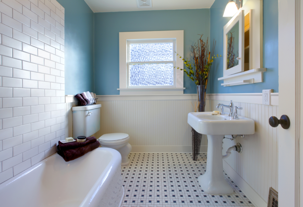 bathroom with white tile a blue painted walls