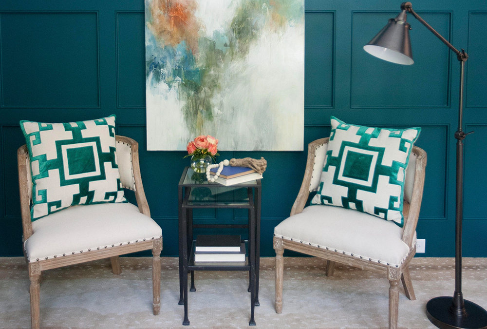 teal wall with chairs with teal accents