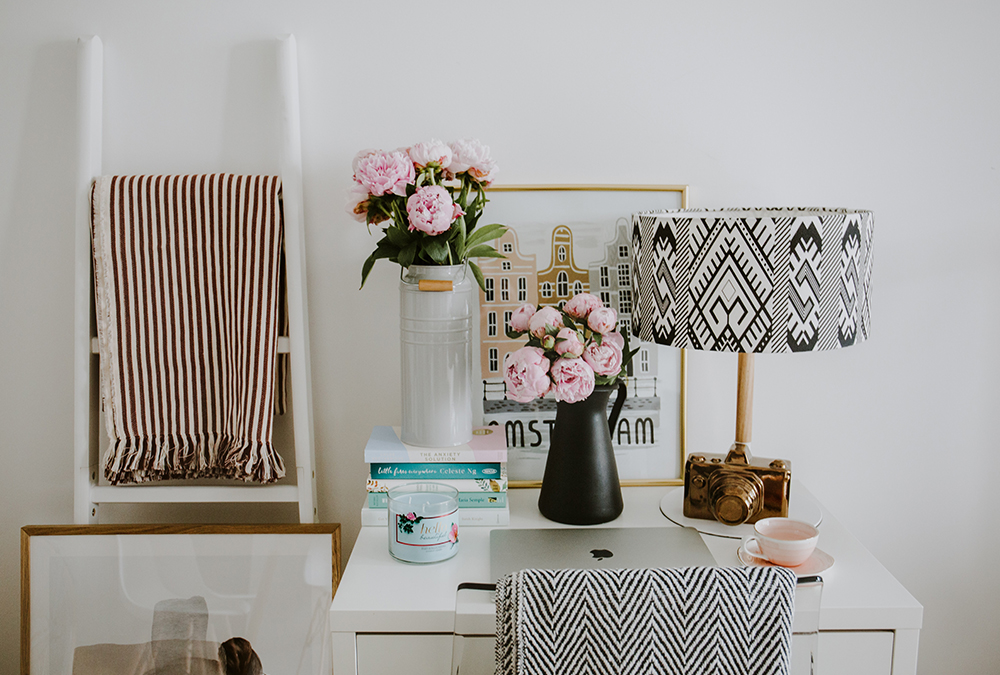 pink flowers on white desk