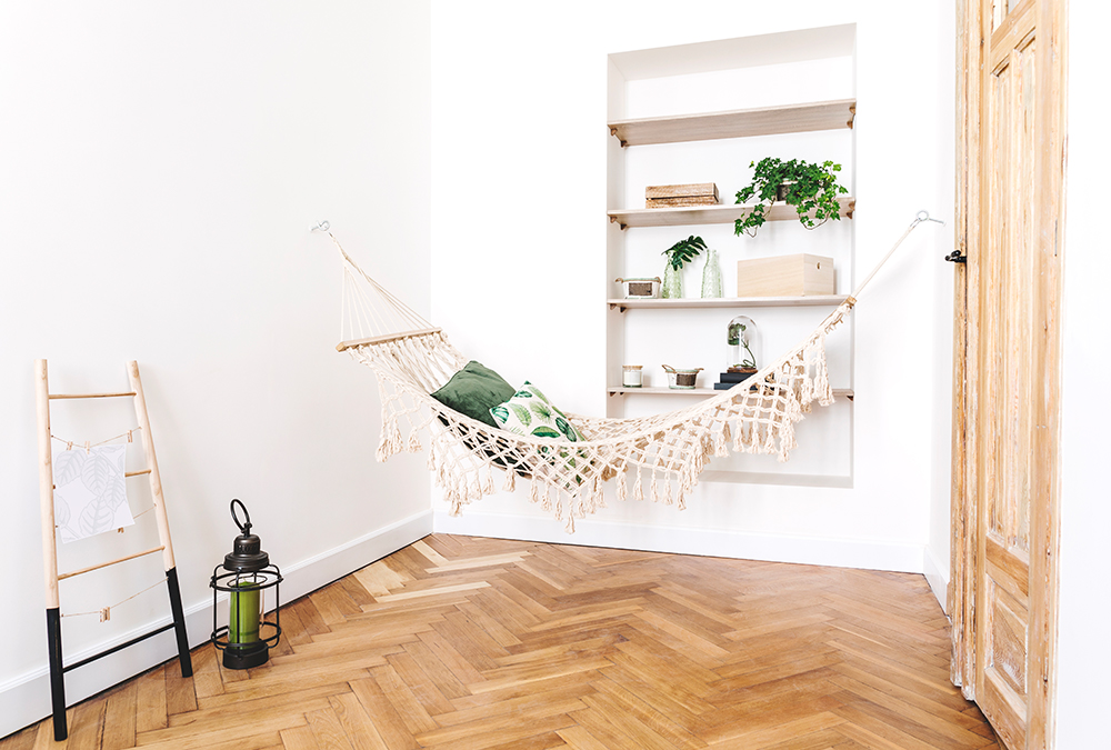 room with bookshelf and hammock