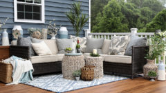 outdoor deck featuring sofas, pillows, and rugs