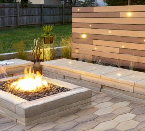 fire pit and stone bench with lighted panel